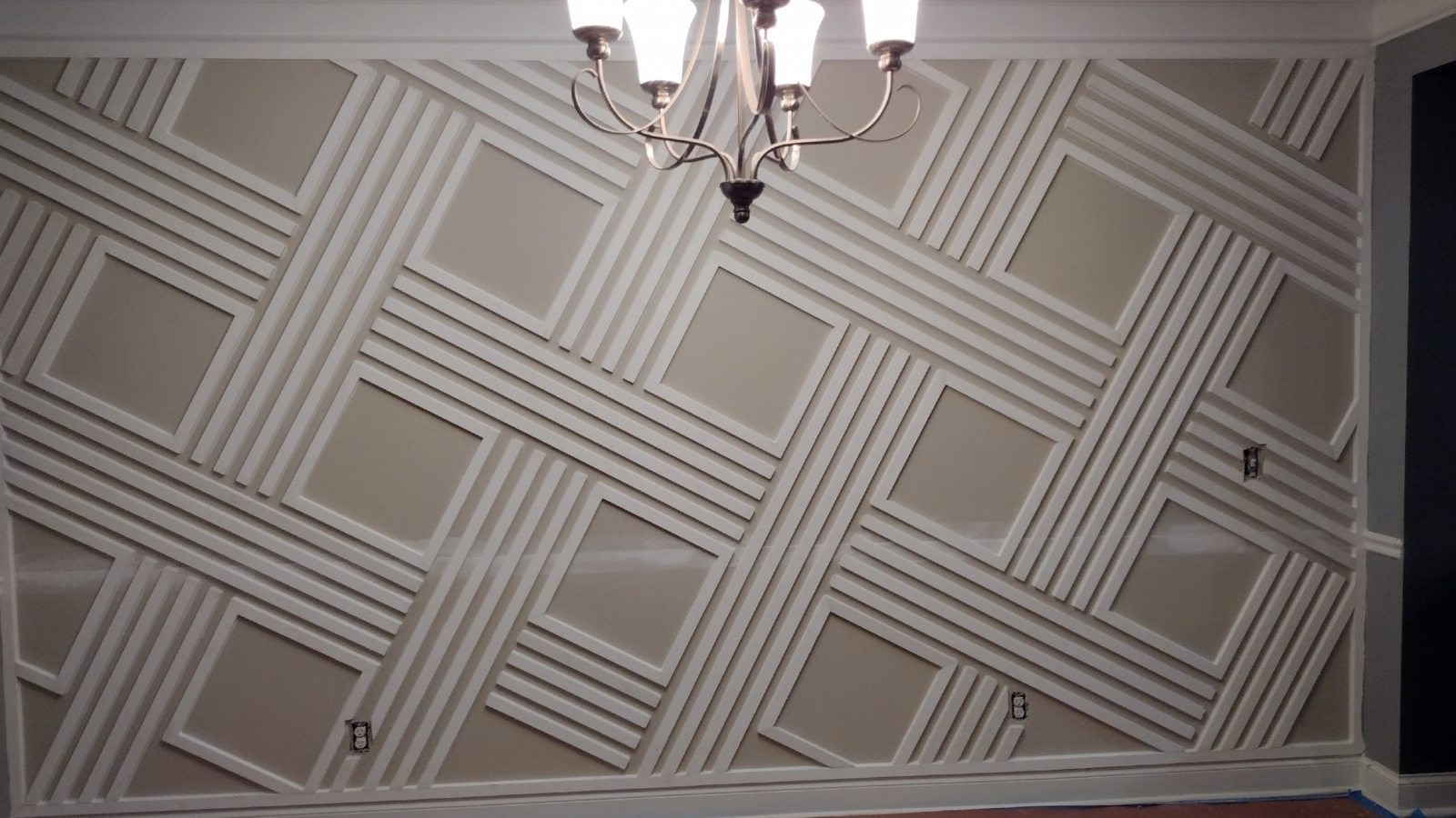 Dining room with custom geometric feature wall